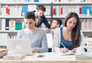 young-college-students-studying-together-PBG8HN8